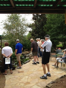 People gather around to learn the secrets of 'How To' build a Waterfall. AND how to take care of your Pond. 
